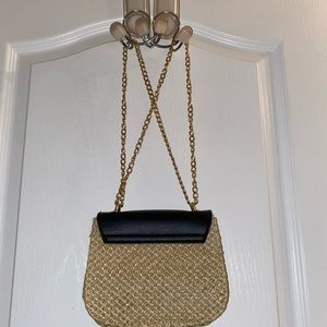Black and straw handbag